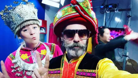 Michael Hope Michael Hoe and a friend pose on oriental costume