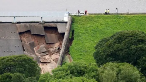 Reuters The collapsed dam