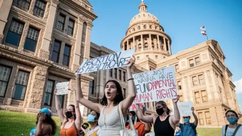 Getty Images Pro-choice protesters march outside the Texas State Capitol this month