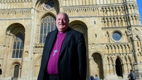 Lincoln Cathedral Bishop Conway standing outside Lincoln Cathedral