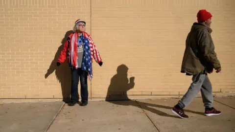 Getty Images Supporters of former US President and Republican presidential candidate Donald Trump arrive at a campaign rally at the Santander arena in Reading, Pennsylvania, on November 4, 2024.