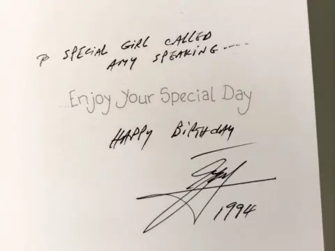 A close-up photo of the inside of a birthday card Amy says Ali sent her. 'To a special girl called Amy Speaking' is written in the card as well as 'happy birthday' and a signature with '1994' beneath 