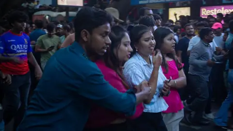 Getty Images Fans of the Royal Challengers Bengaluru (RCB) react outside the the M. Chinnaswamy Stadium on June 04, 2025 in Bengaluru, India.