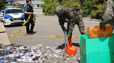 Yonhap Military personnel collect the debris of balloons sent by North Korea in Incheon, west of Seoul, South Korea, 02 June 2024.