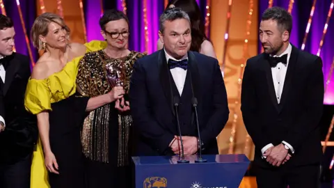 Getty Images Sian Brooke, Louise Gallagher, Declan Lawn and Adam Patterson accept the Drama Series Award for 'Blue Lights' during the 2025 BAFTA Television Awards with P&O Cruises Ceremony at The Royal Festival Hall on May 11, 2025 in London, England.