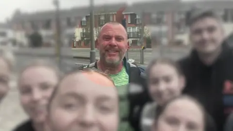 handout Grant Williams with his running group