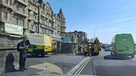 Ambulance and fire crews on the street outside the Grand Atlantic Hotel