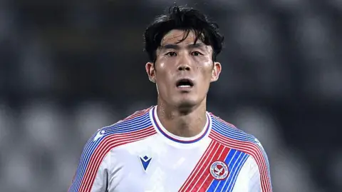 Takehiro Tomiyasu playing for Crystal Palace during a pre-season friendly against AlUla in 2026