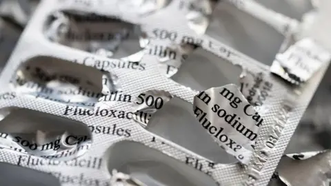 A foil-covered tablet packet with lots of empty pockets