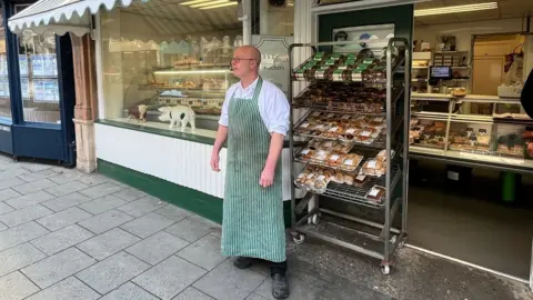 Butcher John Woolliss in front of his shop in Louth town centre