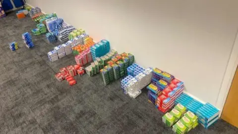 Multiple boxes of medicine and tablets on the floor of a Nottinghamshire police station