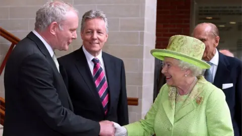 Getty Images Queen Elizabeth II's historic handshake with former IRA leader Martin McGuinness in Belfast on 27 June 2012