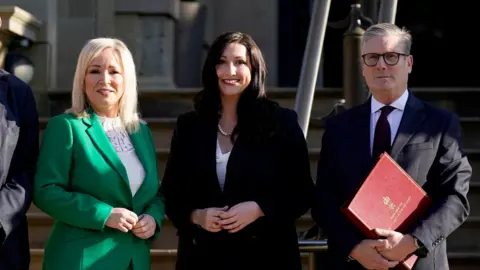Niall Carson/PA First Minister Michelle O'Neill, Deputy First Minister Emma Little-Pengelly and Prime Minister Sir Keir Starmer at Stormont Castle last year