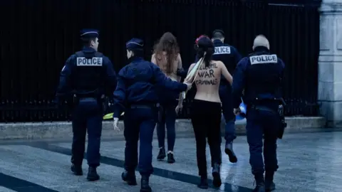 AFP Femen protesters are taken away