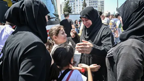 AFP In this file photo taken on August 06, 2019, family and friends say goodbye as Syrian refugee voluntarily board buses returning to neighbouring Syria in the Esenyurt district of Istanbul