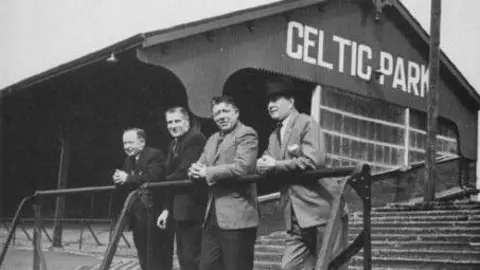 Belfast Celtic Society Men standing in grounds of Celtic Park