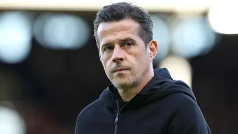 Fulham boss Marco Silva with a thoughtful expression before a match