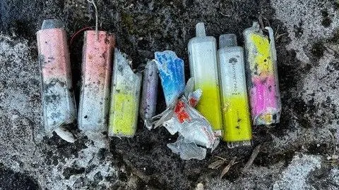 The vapes removed from the sewer are colourful pinks and yellows but covered in grime