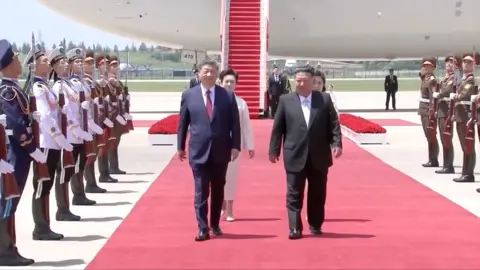 Xi Jinping and Kim Jong Un