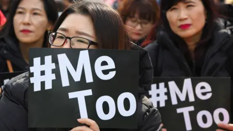 Getty Images South Korean demonstrators hold banners during a rally to mark International Women's Day as part of the country's #MeToo movement in Seoul