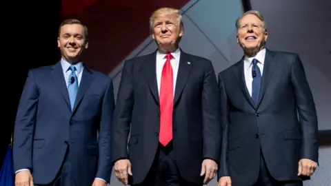 AFP/Getty Lobbyist Chris Cox, President Donald Trump and NRA president Wayne LaPierre
