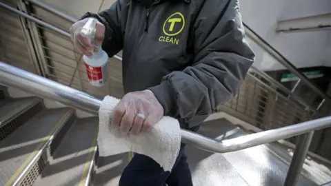 Getty Images  MBTA employees disinfect areas of the Government Center T Station in Boston on March 5, 2020, amid efforts to step up cleaning to defend against coronavirus