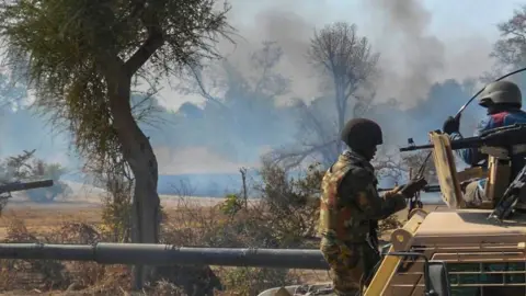 EPA A handout picture released by the Nigerian Army shows an insurgents' camp being destroyed by Nigerian military in the Sambisa forest (archive pic)