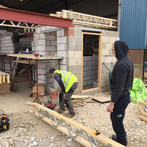 Scandia Ltd Scandia employees working at a building site in Norfolk installing wooden frames for a project