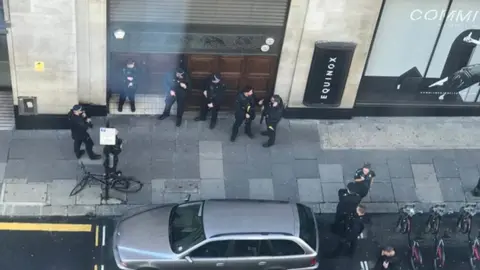 Trish Ellis/PA Wire Armed police at scene