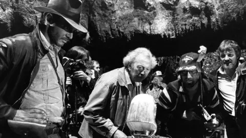 Lucasfilm Ltd Les Dilley on the set of Raiders of the Lost Ark with Harrison Ford and Steven Spielberg