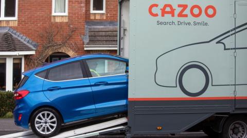Car being loaded onto Cazoo van