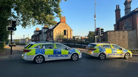 Alice Cunningham/BBC The police cordon at Burrell Road in Ipswich following the incident