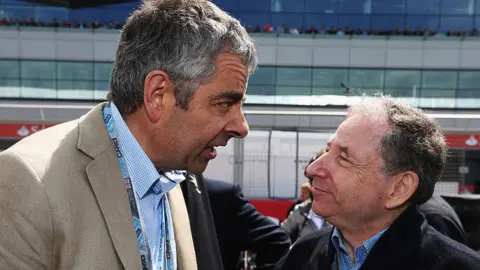 Mark Thompson/Getty Images Rowan Atkinson and Jean Todt