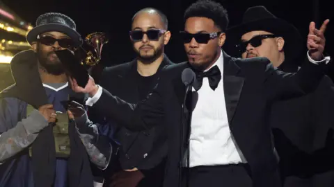 Getty Images Knxwledge and Anderson .Paak on-stage accepting the best progressive R&B album award