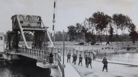 Troops crossing Pegasus Bridge - a river crossing close to the Normandy beaches invaded on D-DAY. Normandy Landings World War Two WWII Second World War Caen June July 1944