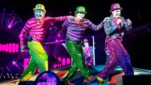 Getty Images (L-R) Mark Owen, Howard Donald and Gary Barlow of Take That perform live on stage during the "The Circus Live" stadium tour at St Mary's Stadium on May 29, 2026 in Southampton, England.
