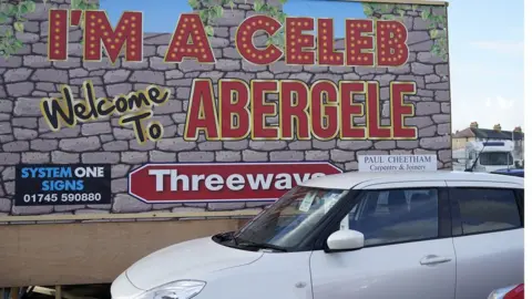 Christopher Furlong / Getty Images A sign welcoming the show to Abergele