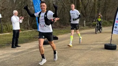 Debbie Granville PR Chris Bryer-Ash (left) and Chris Helberg running at the start of their seven-day running challenge