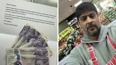 Five £20 cash notes in GBP are spread out over a piece of paper used as a letter. On the right is a man with a beard, grey hoodie and red apron stood behind fruit and vegetables in a supermarket.