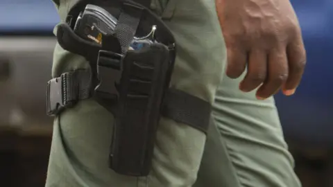 NurPhoto Officer with gun