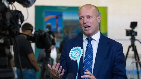 Dan Thomas, leader of Reform in Wales speaks to the media after the Casnewydd Islwyn Senedd constituency vote count, at the Geraint Thomas National Velodrome, Newport. 