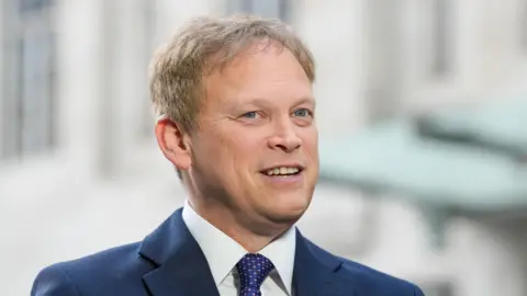 Grant Shapps in a suit and tie
