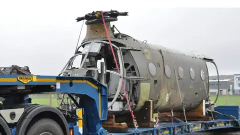 The Helicopter Museum The wrecked skeleton of the front half of the Flying Banana, being transported on an articulated lorry