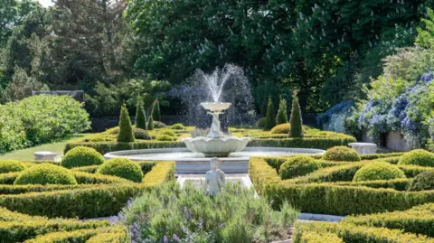 Knight Frank A fountain in well-kept gardens