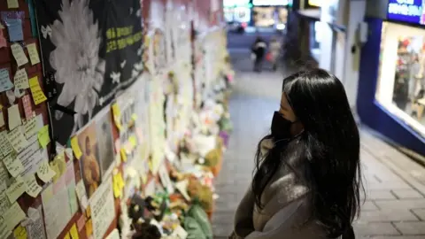 Reuters woman reads condolence messages