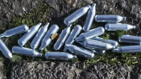 Getty Images Pile of silver canisters