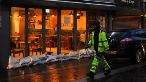 Reuters Sandbags outside a cafe in Pontypridd, which was also flooded last weekend.