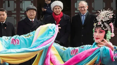 Getty Images Theresa and Philip May watch traditional Beijing opera