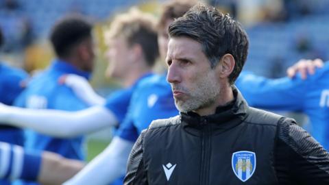 Colchester United boss Danny Cowley looks on during a training session