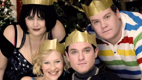 Actors Ruth Jones, Joanna Page, Matthew Horne and James Corden stood together with gold paper Christmas hats